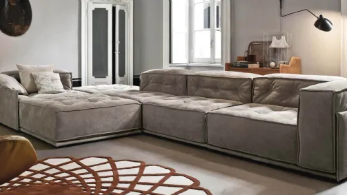Glamor. Sectional leather sofa with buttons