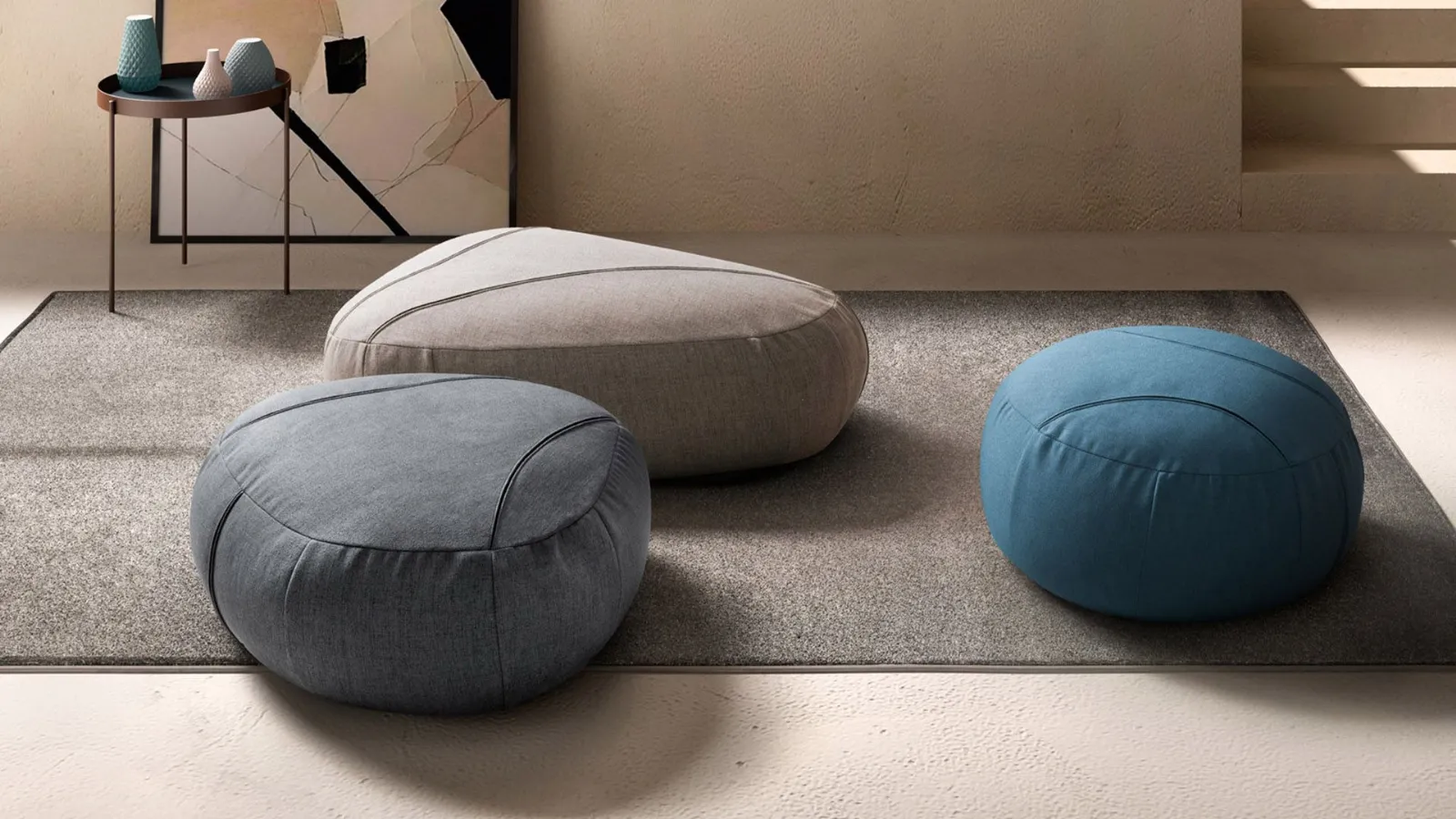 Sassi. Three soft poufs with shaped shapes