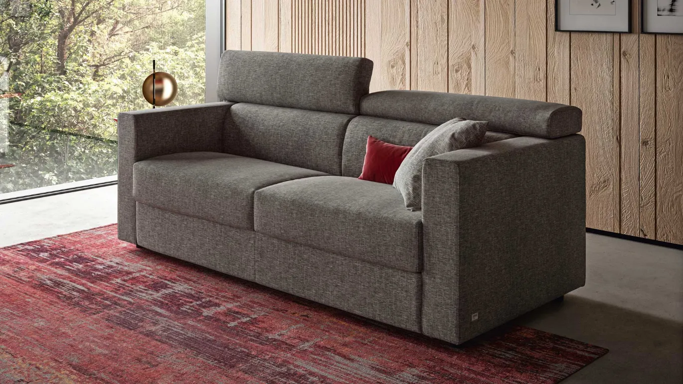 Sofa bed with reclining headrest